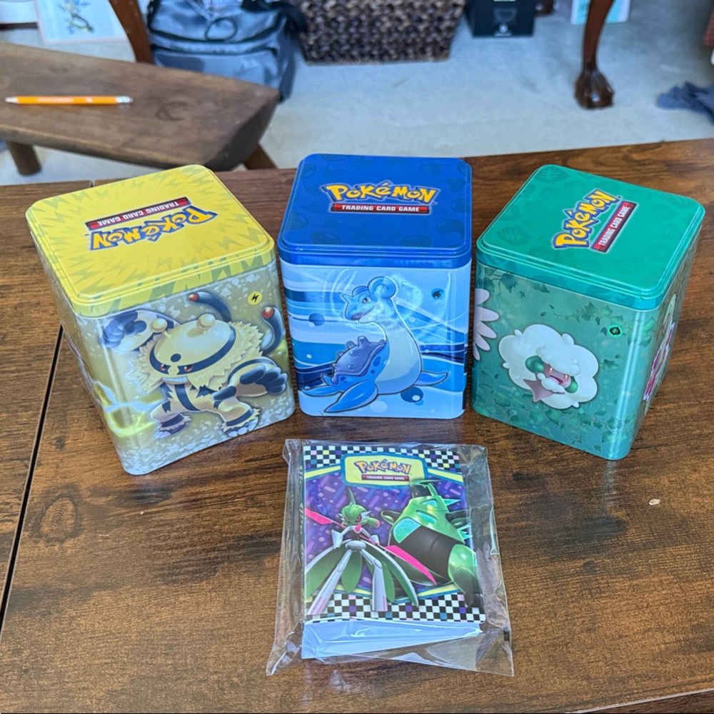 Pokémon 3-Tin Set with card folio- Blue, Green, Yellow